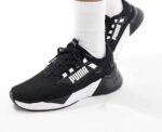 Puma Retaliate 3 trainers in black & white