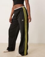 Firebird Loose track pants in black and light green