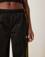 Firebird Loose track pants in black and light green - Image 5
