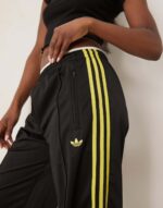 Firebird Loose track pants in black and light green - Image 4